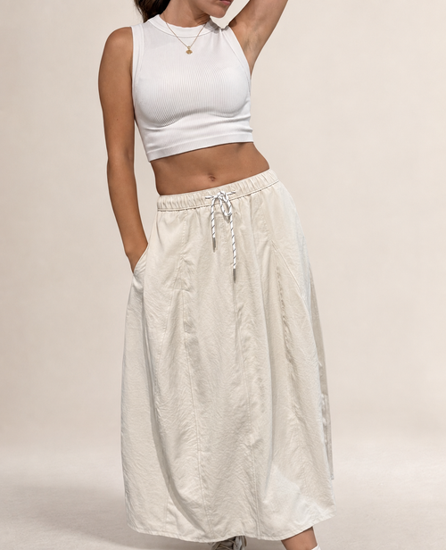 Angled studio view of Pretty Hours lightweight khaki drawstring midi skirt