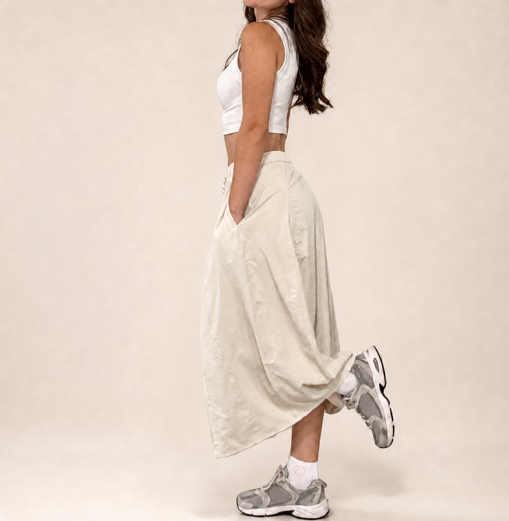Side studio view of Pretty Hours lightweight khaki drawstring midi skirt