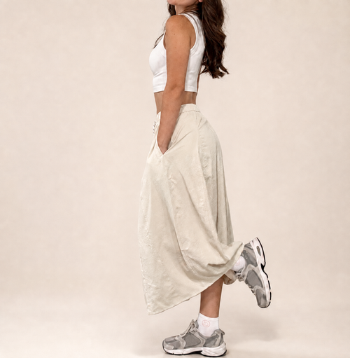 Side studio view of Pretty Hours lightweight khaki drawstring midi skirt